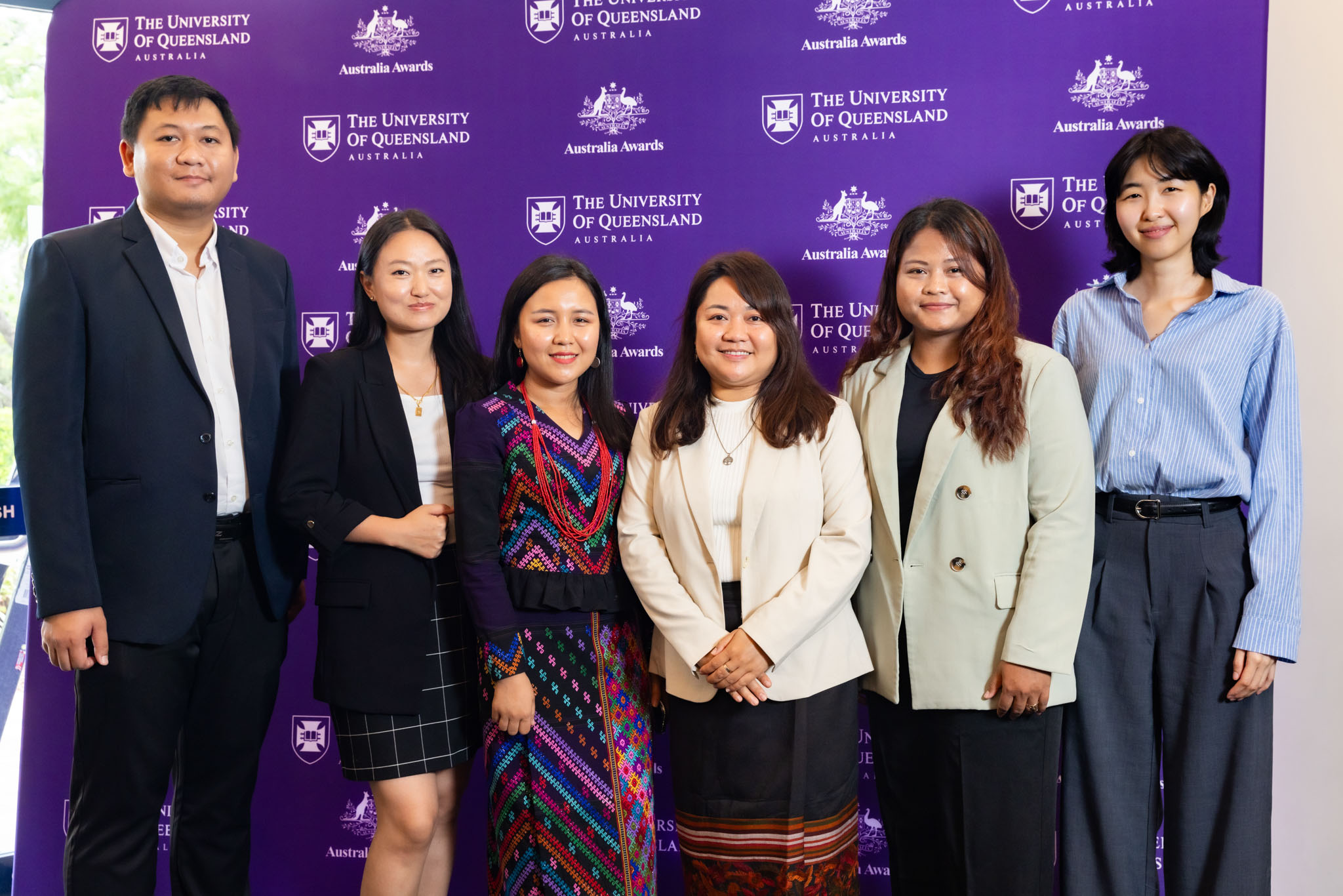 Tashi (second from left) pictured with other Australia Awards scholars at a university event.